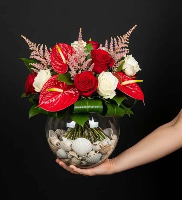 Crimson Sea: Anthurium, Rose & Seashell Arrangement in a Glass Bowl