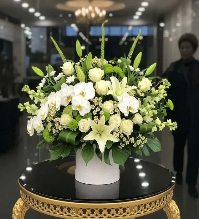 Symbol of Elegance: White Orchid & Lily Arrangement